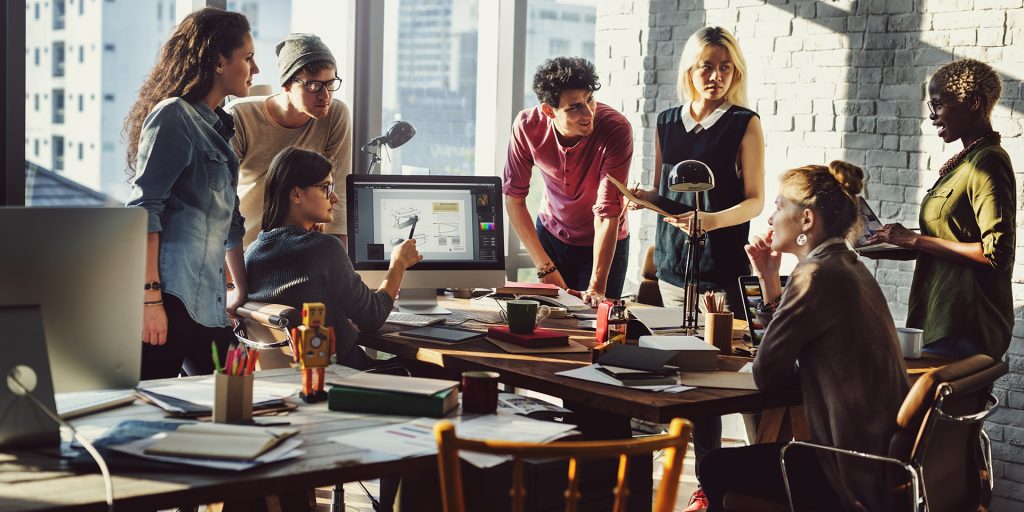 busy-office-setting-seven-people-reviewing-report-computer-active-participation-focus-attention-towards-one-lady