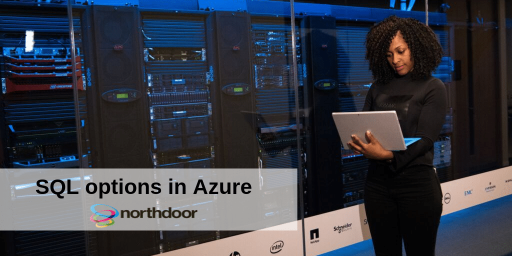 SQL options in Azure picture of a lady in a data centre holding a laptop 