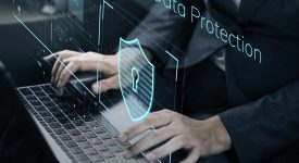 data protection with lock floating above a keyword whilst a man types