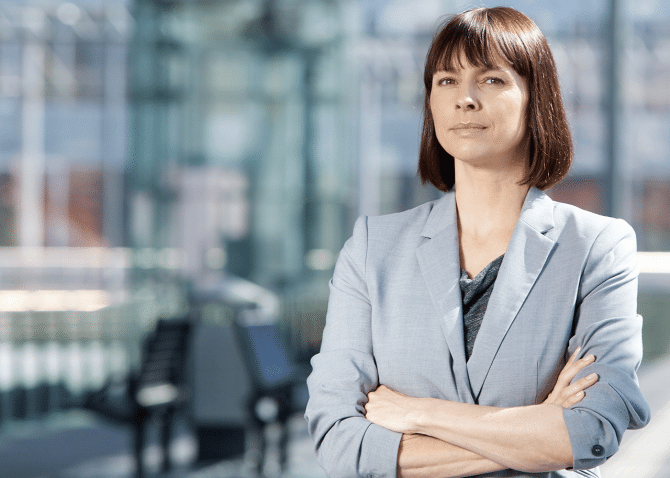 Business women standing with arms crossed