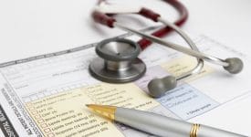 Stethoscope and Pen on top of a form