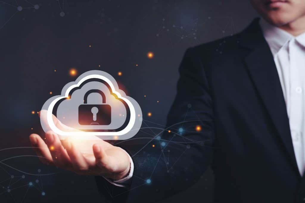 Image of man holding a cloud graphic with a lock and key in the centre