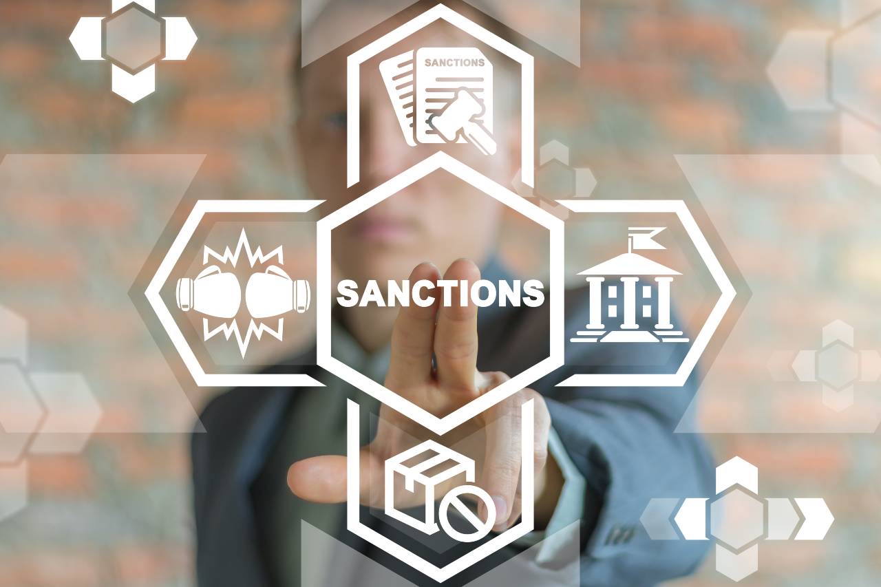 image of sanctions with icons of boxing gloves and paperwork around it