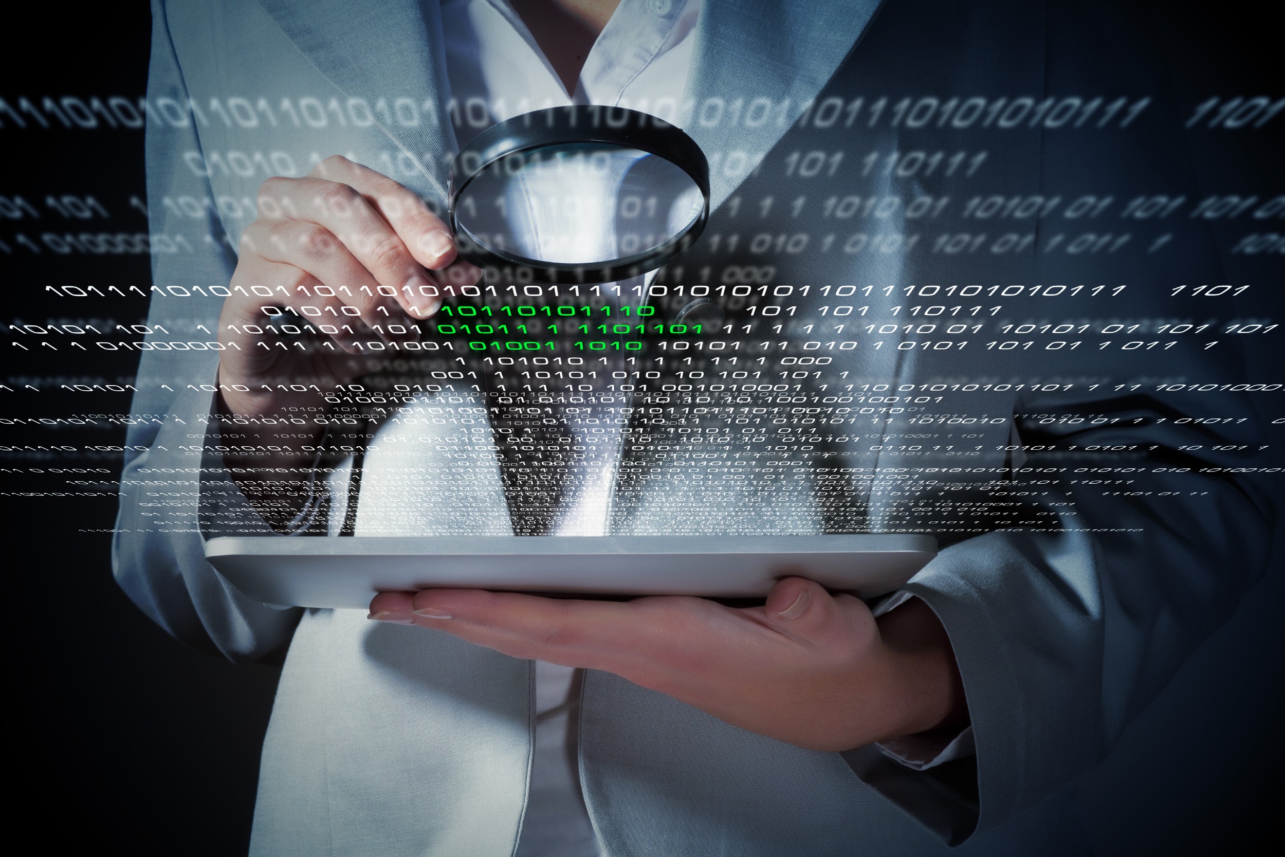image of person holding device in one hand and magnifying class in the other with graphic of code overlaying between the two items